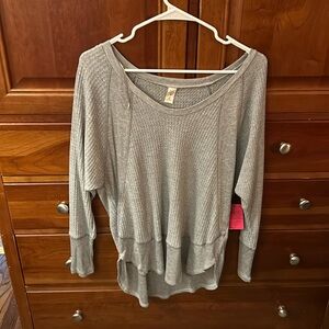 NWT fabulous light grey soft as butter high-low top. Trimmed sleeves and bottom.